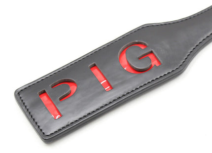 Ohmama fetish pig paddel aus schwarzem leder mit roter pig schrift für fetish spiele