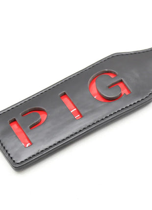 Ohmama fetish pig paddel aus schwarzem leder mit roter pig schrift für fetish spiele