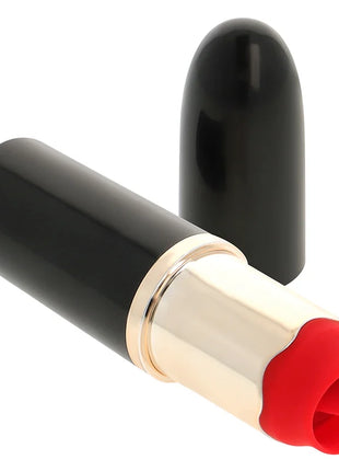 Ohmama lippenstift mit vibrierender zunge in schwarz mit goldband und roter silikonspitze gelegen in schlankem zylinder