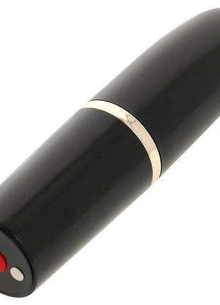 Ohmama lippenstift mit vibrierender zunge schwarzes zylindrisches elektronikgerät mit goldband und rotem powerknopf