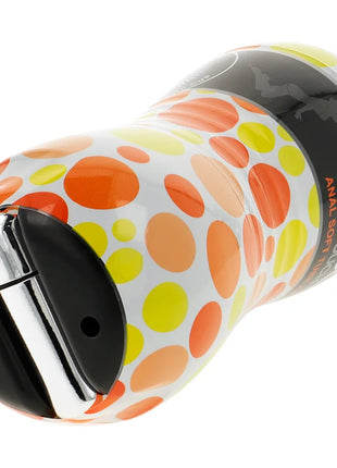 Ein weißer ohmama masturbator mit anusvibration, orange-gelben punkten und schwarz-chrom kappe