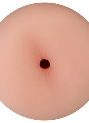 Ein realistischer, hautfarbener silicone analplug von ohmama mit zentraler dunkler öffnung und anusvibration