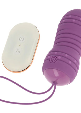 Lila silikon vibrator ei mit fernbedienung und goldenen akzenten 7 rotierende muster von ohmama