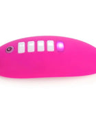 Vibrant pink silicone ohmibod lightshow-lichtstimulator with five white buttons and glowing purple light on the right side
