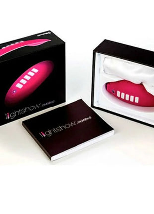 Vibrant pink ohmibod lightshow-lichtstimulator mit fernbedienung und fünf weißen tasten seitlich