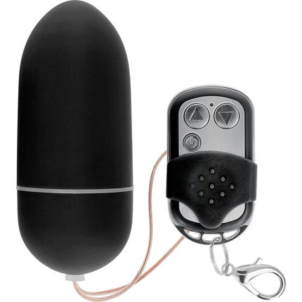 Schwarzes silikon vibrator ei mit silbernem akzentband und fernbedienung mit dreieckigen tasten und keychain