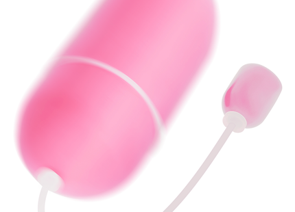 Rosa wasserdichtes vibrations-ei aus silikon mit weißem kabel und pinker spitze für angenehme anwendung