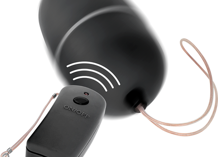 Schwarzes wireless-türklingelgerät mit rundem domdesign und fernbedienung mit an aus beschriftung