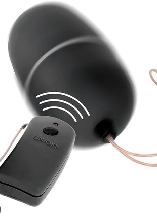 Schwarzes wireless-türklingelgerät mit rundem domdesign und fernbedienung mit an aus beschriftung