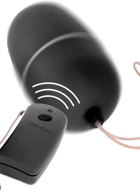 Schwarzes wireless-türklingelgerät mit rundem domdesign und fernbedienung mit an aus beschriftung