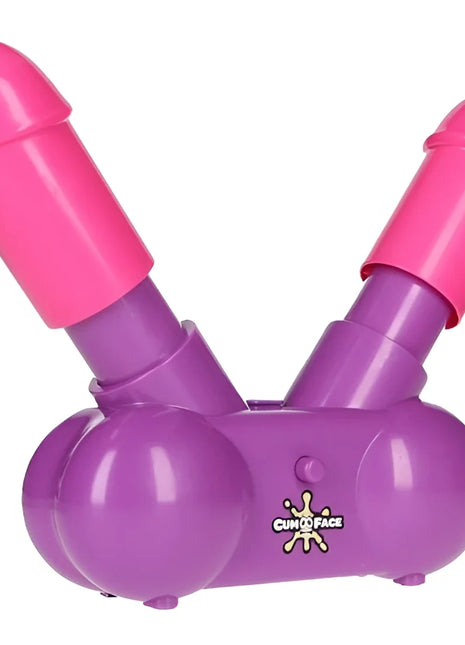 Lila und pinkes plastikspielzeug cumo face mit zwei zylindrischen enden aus der play wiv me cum face party spiel serie