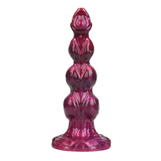 A glossy deep magenta silicone anal plug with segmented design and ridges from power monsters primal beastlord
