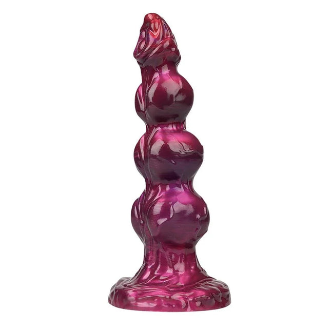 Glänzender tief magentafarbener silikon analplug mit segmentiertem design und strukturiertem sockel von power monsters primal beastlord