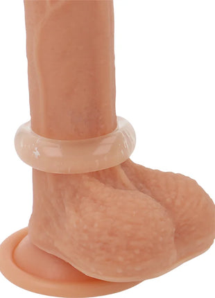 Peachfarbener silikon dildo mit transparentem glänzendem ring und strukturiertem griff für super flexiblen penisring