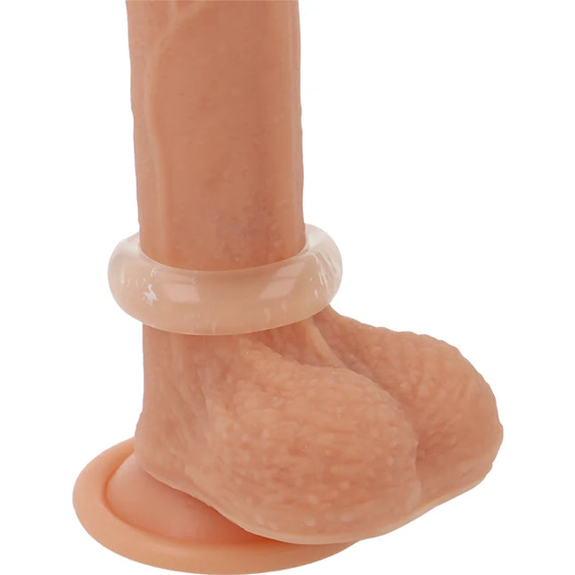 Peachfarbener silikon dildo mit transparentem glänzendem ring und strukturiertem griff für super flexiblen penisring