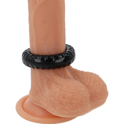 Schwarzer powering super flexibler und widerstandsfähiger penisring 4,5 cm aus texturiertem material an silikon dildo