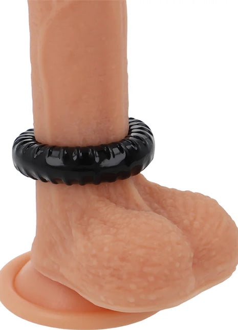 Schwarzer powering super flexibler und widerstandsfähiger penisring 4,5 cm aus texturiertem material an silikon dildo