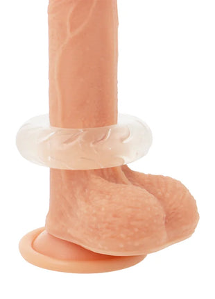 Peachfarbener silikon dildo mit klarem, strukturiertem ring um den schaft und rundem basisring powering super flexibler penisring 5cm pr08 klar