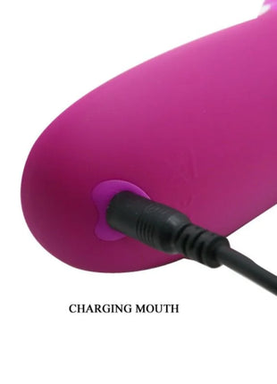 Ein lebhafter pinkfarbener silikon-ladeanschluss mit schwarzem usb-kabel im produkt pretty love adrian