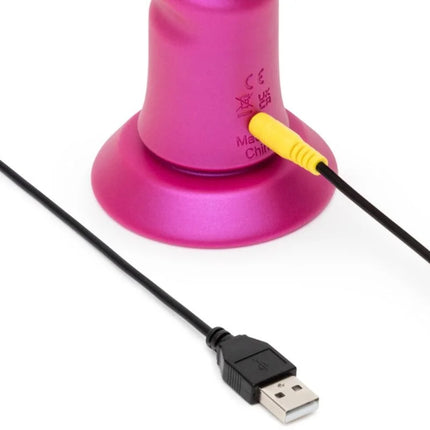 Romp jiggle stoßvibrator in pink metall mit gelbem usb-stecker und saugnapf am boden