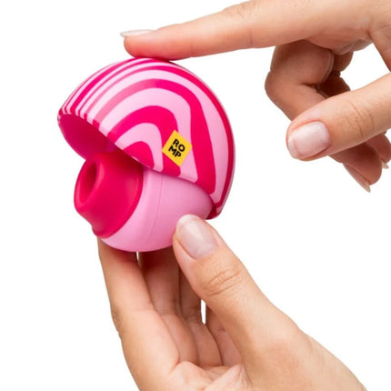 Runder auflegevibrator romp spin in pink und magenta aus plastik mit kompaktem format für äußere stimulation