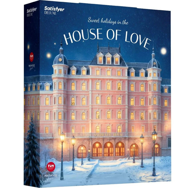 Rosa mehrstöckiger hotel-puzzle-box mit beleuchteten fenstern und schneebedecktem grundstück im satisfyer deluxe adventskalender