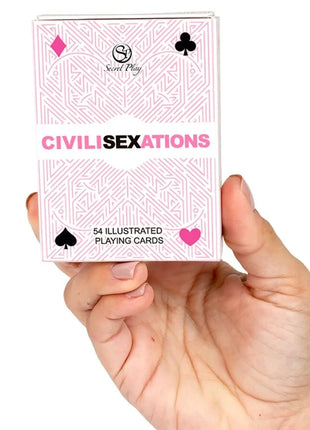 Pink und weiße illustrierte spielkarten im karton civil sexations von secret play für paare
