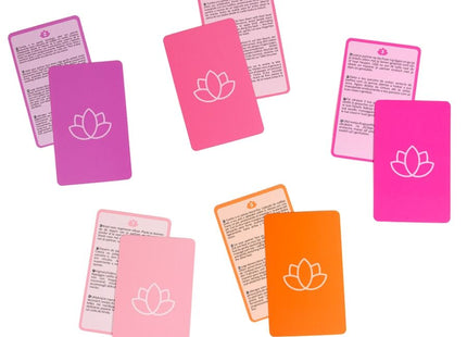 Set bunter rechteckiger massagekarten secret play paarspiel mit weißen lotusmotiven auf rosa und orange silikonoberflächen