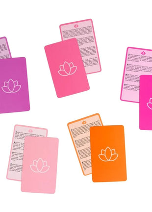 Set bunter rechteckiger massagekarten secret play paarspiel mit weißen lotusmotiven auf rosa und orange silikonoberflächen