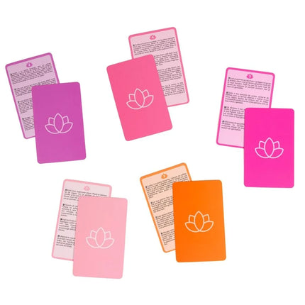 Set bunter rechteckiger massagekarten secret play paarspiel mit weißen lotusmotiven auf rosa und orange silikonoberflächen