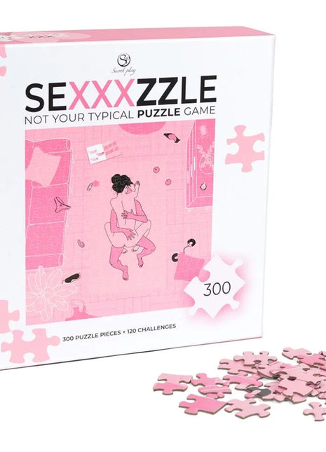Rosa puzzlekasten für das sexxxzzle spiel von secret play mit spielerischer illustration zweier figuren in intimer szene