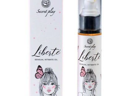 Weiße zylinderflasche mit schwarzem pumpenspender und silberner basis für liberté sensual intimate oil von secret play