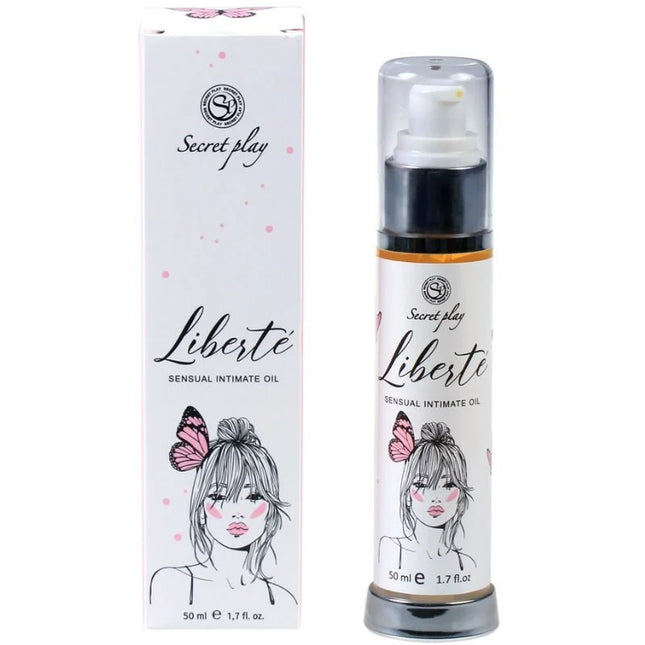 Weiße zylinderflasche mit schwarzem pumpenspender und silberner basis für liberté sensual intimate oil von secret play