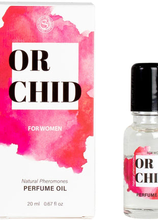 Eine klare glasflasche mit schwarzem deckel und rosa aquarelle etikett enthält secretplay orchideen-parfümöl mit natürlichen pheromonen 20 ml