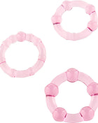 Seven creations set aus drei rosa penisringen aus durchsichtigem kunststoff mit abgerundeter segmentierter form