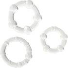 Set aus drei weißen glänzenden plastikringen mit abgerundeten erhebungen von seven creations
