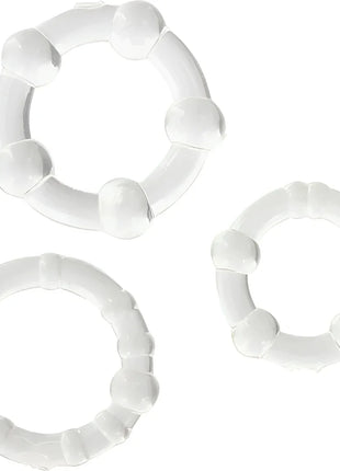 Set aus drei weißen glänzenden plastikringen mit abgerundeten erhebungen von seven creations