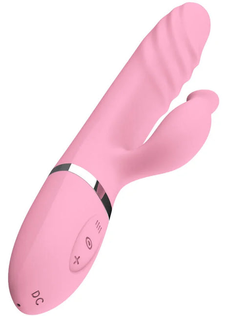 Pink silikonspielzeug mit gewölbtem, geripptem design und silbernem akzentband bei sinnliche stimulation wärmezunge und vibration fuchsia
