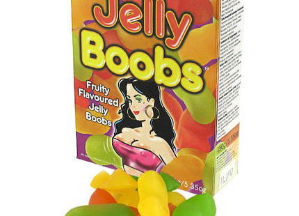 Bunte box kaubonbons in form von brüsten mit cartoonillustration und fruchtigen jelly bonbons vorne liegend