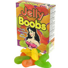 Bunte box kaubonbons in form von brüsten mit cartoonillustration und fruchtigen jelly bonbons vorne liegend