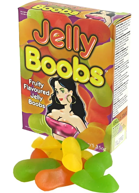 Bunte box kaubonbons in form von brüsten mit cartoonillustration und fruchtigen jelly bonbons vorne liegend