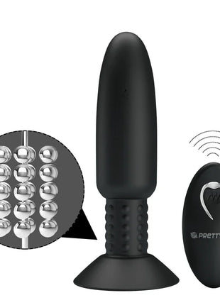 Schwarzer silikon-stecker mit vibration und rotation und silbernen metallperlen am schaft mit passendem steuergerät