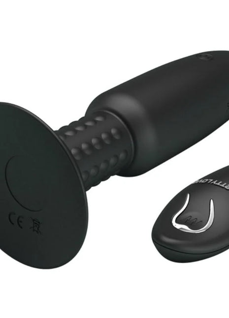 Schwarzer silikon vibrator mit fernbedienung und strukturierter grifffläche für vibration und rotation