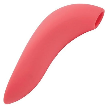 Ein schlanker coral-pinker silikonlöffelrest mit glattem, geschwungenem design für we-vibe melt sucker app