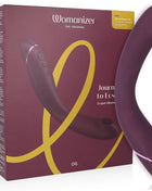 Violetter womanizer og g-spot vibrator mit schlankem, gebogenem design und subtiler leuchtender akzentlinie