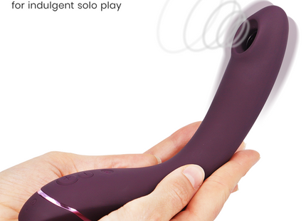 Womanizer og g-spot aubergine lila silikon luftklitorisstimulator mit elegantem, gebogenem design und rosa akzentbeleuchtung