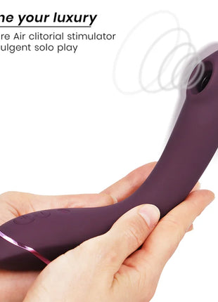 Womanizer og g-spot aubergine lila silikon luftklitorisstimulator mit elegantem, gebogenem design und rosa akzentbeleuchtung