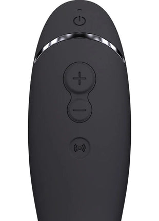 Womanizer OG G spot schiefer remote control in black matte finish with silver trim and three circular buttons