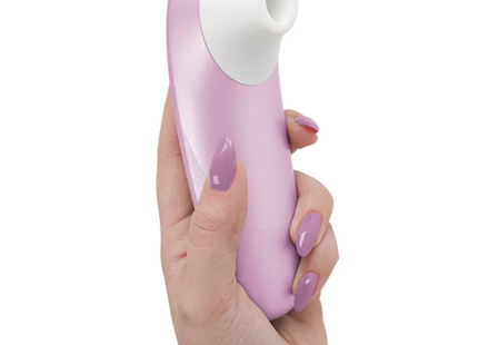Womanizer pro vibrant klitoralstimulator in hellrosa und weiß aus silikon mit geschwungenem, glattem design