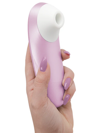 Womanizer pro vibrant klitoralstimulator in hellrosa und weiß aus silikon mit geschwungenem, glattem design